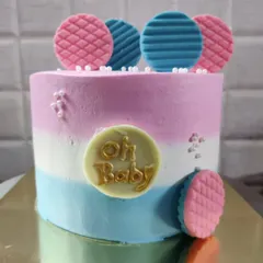 An "Oh Baby" cake, perfect for a baby shower or gender reveal party. The pink and blue colors keep everyone guessing.
