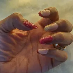 Giving the classic French a festive twist with shimmery red and gold. This is a great look for the holidays or any celebration.