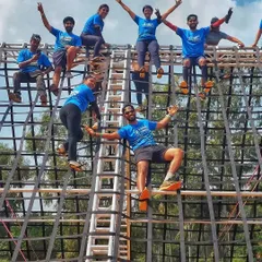Getting a different perspective from the top of a Spartan obstacle. It’s not just about running; it’s about facing challenges, helping each other over walls, and enjoying the view from the top.