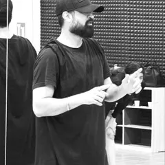 A focused moment during a rehearsal. As a coach, I pay close attention to the details to ensure the final performance is polished and powerful.