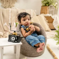 A little gentleman making a call. Sitter sessions are perfect for capturing babies as they begin to interact with props and show off their budding character.