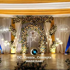 A beautiful Holy Communion stage setup with white and blue accents. The floral arches and chandeliers create a celebratory yet graceful atmosphere for this important spiritual milestone.