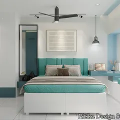 This bedroom features a soothing teal and white color scheme. We designed a custom bed with a channel-tufted headboard and integrated a floating desk and a window seat, making the room multifunctional for both rest and work.