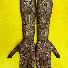 This design showcases a beautiful flow from the detailed floral work on the fingers to the bolder, more structured patterns on the forearms.