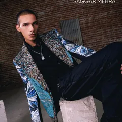 Wings of craft, stitched in detail. This look showcases the bold interplay of print, texture, and symmetry, where the butterfly becomes the canvas for a jacket with purpose and presence.