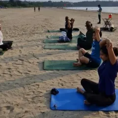 A moment of focus during our beach yoga session. Here, we are practicing Gomukhasana arms to open the shoulders and chest, all while breathing in the fresh sea air.