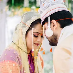 A moment of quiet connection during the wedding pheras. Prerna and Abhiroop's foreheads touching is a powerful, intimate gesture that speaks volumes about their bond during their Marathi Bengali wedding.
