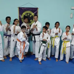 My students of various ages and ranks standing together after their kyu grading. It is rewarding to see their progress and the supportive community they have built together in the dojo.