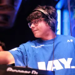 A cool shot of me behind the decks, in my element. This photo captures the focus and passion I have for my craft.