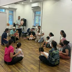 A beautiful moment showing different family members bonding with their children in class. We love creating a space where dads, moms, and grandparents can share in the musical journey.