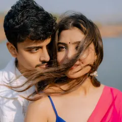 A close-up shot that captures the intense, romantic gaze of a classic Bollywood scene. The wind blowing through her hair adds a touch of natural drama.
