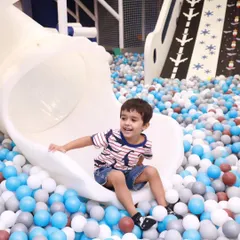 A perfect action shot of a happy kid landing from our spiral slide. The smile says it all, this is what pure, simple fun looks like.
