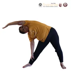 A student demonstrates Trikonasana (Triangle Pose). Proper exercise through asanas is the first point of our method, promoting flexibility and strength.