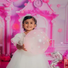 A bright, happy smile that says it all! This little girl loved celebrating her second birthday with a magical Barbie photoshoot.