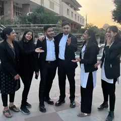Sharing a lighter moment after a demanding day. The camaraderie in our team is what keeps us going through the pressures of legal practice.
