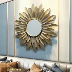 This sunburst mirror, framed by layers of golden metal leaves, adds a touch of luxury and light to any room. It's a perfect decorative mirror for a bedroom or living area, designed to make your space feel brighter and more elegant.