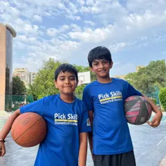 Two teammates and friends, ready for practice. The bonds formed on the court are just as important as the skills learned, and we encourage a strong sense of camaraderie.