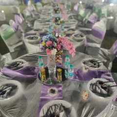 An elegant sit-down dinner arrangement for a wedding reception. We work closely with decorators to ensure our catering setup complements the event's aesthetic perfectly.