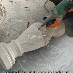 Stone carving work in progress in India at our facility. This image captures the initial stages of creating intricate patterns on what will become a beautiful stone birdbath.