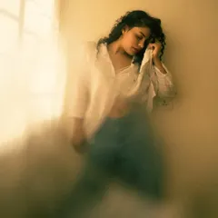 This is a motion blur variation from the same natural light series. A slower shutter speed combined with the model's movement creates a painterly effect, showing how you can experiment to get different results from the same setup.