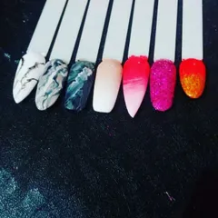 A few sample nail tips to spark your imagination. This shows different techniques like black and white marble, a pink ombre fade, and full-coverage glitter.