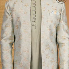 Elegance woven in style. This close-up of a light green Indo-Western jacket shows the beautiful floral brocade fabric and the unique button placket of the kurta underneath.
