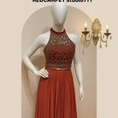 A closer look at the details of my wine-rose halter neck top and flared skirt set. The design focuses on a modern silhouette while retaining a sense of ethnic elegance, making it perfect for evening receptions.