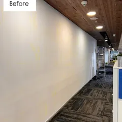 Every great mural starts with a blank canvas. This was the empty wall at the RHI Magnesita office before I began painting their story.