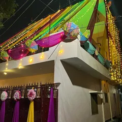 The wedding home decor looks spectacular at night with all the lights turned on. The colorful drapes and fairy lights create a truly festive look.