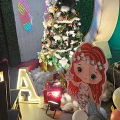 Part of the mermaid theme decoration, this corner also featured a festive Christmas tree, blending two themes for a unique December birthday party.
