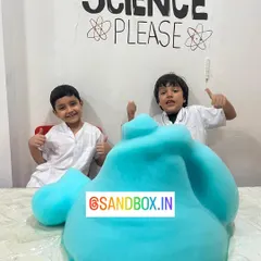 We love mixing up mysterious potions in our chemistry class. These two scientists are giving a big thumbs up after creating a massive blue foam eruption, learning about chemical reactions and catalysts.