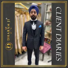 A client looking dapper in a custom-fitted black three-piece tuxedo with a bow tie and a blue pocket square. The perfect fit is evident.