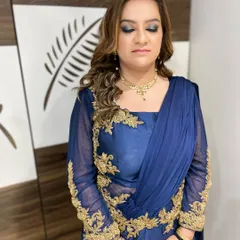 A close-up of a dramatic smokey eye in shades of grey and black, paired with a nude lip. This is a classic choice for a bold and confident cocktail party look.