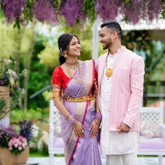 The lovely couple, Shreya and Siddhanth. Her lilac saree perfectly matches the decor theme, creating a cohesive and visually stunning look for their garden engagement photos.