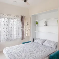 This Murphy bed with an integrated sofa is the perfect solution for a guest room or a studio apartment. It transforms from a stylish seating area to a comfortable bed in seconds.