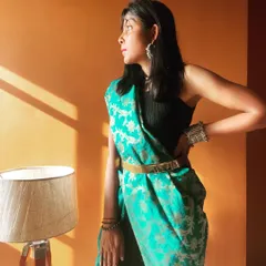 A modern take on traditional wear. In this photo, I've styled a beautiful green Banarasi dupatta as a pant-saree, cinched at the waist with a metallic belt. This fusion look is comfortable, stylish, and perfect for when you want to stand out.