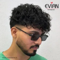 Another angle showcasing the sharp lines and texture of this men's haircut. It's a versatile look that can be styled in different ways.