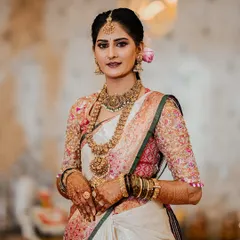 It's a joy to see my clients shine. Here is my beautiful bride Chethana, looking absolutely radiant on her wedding day in her custom-designed Kanchipuram saree and a meticulously hand-embroidered blouse that we created together.
