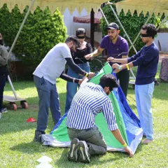 Forget boring trust falls. We design unique team bonding activities like this blindfolded tent pitching challenge. It is a fun, hands-on problem solving game that requires communication, collaboration, and a lot of laughter to succeed, revealing leadership skills you might not see in the office.