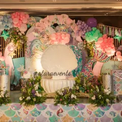 I love creating enchanting underwater worlds, complete with shimmering sequin backdrops and a giant clamshell throne for the birthday star. This mermaid theme is a perfect example of how I blend custom props with balloon art to create a magical atmosphere.
