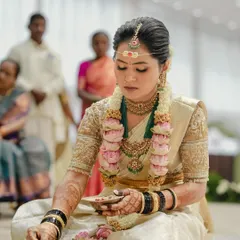 A candid moment from Harshitha's Muhurtham. Her entire look, from the saree to the intricately detailed blouse, was curated by us to match the sanctity and grace of the occasion.