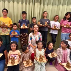 Look at this proud crew of young artists. After our clay modeling workshop, they each have their very own handmade Ganesha idol to take home. We guide them step by step, making it a fun and fulfilling experience for every child.