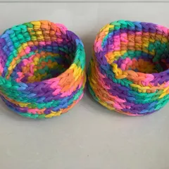A pair of my rainbow storage baskets. They are great for keeping your small essentials tidy and easy to find.