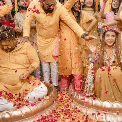 A lively Haldi ceremony filled with laughter and flower petals. We capture the candid moments of celebration as the couple is showered with love by their family and friends.