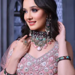 A happy and confident model. The makeup is designed to look flawless on camera, with a focus on glowing skin and beautifully defined eyes.
