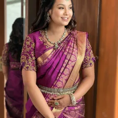 A dewy, minimal look for this bride in a royal purple silk saree. Her natural glow is enhanced, and her soft, loose waves complete this beautiful, modern-traditional transformation.