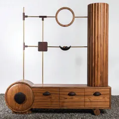 I believe furniture should be art. This unique TV unit is a testament to that philosophy, combining geometric forms like circles, squares, and cylinders in solid teakwood and brass. It’s a functional sculpture that provides storage while being a conversation starter.