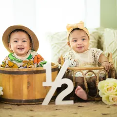 Double the fun for this half-birthday! These adorable twins are celebrating six months together in a beautiful, rustic-themed studio setup.