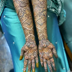 Another angle of the full bridal henna, showing how the design flows from the palm up the arm. The use of my organic henna ensures a dark and even application.
