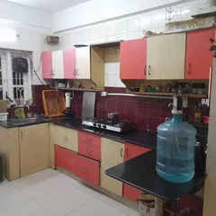 **BEFORE:** A classic case of a dated and dark kitchen. The layout was inefficient, storage was lacking, and the color scheme made the space feel smaller than it was.